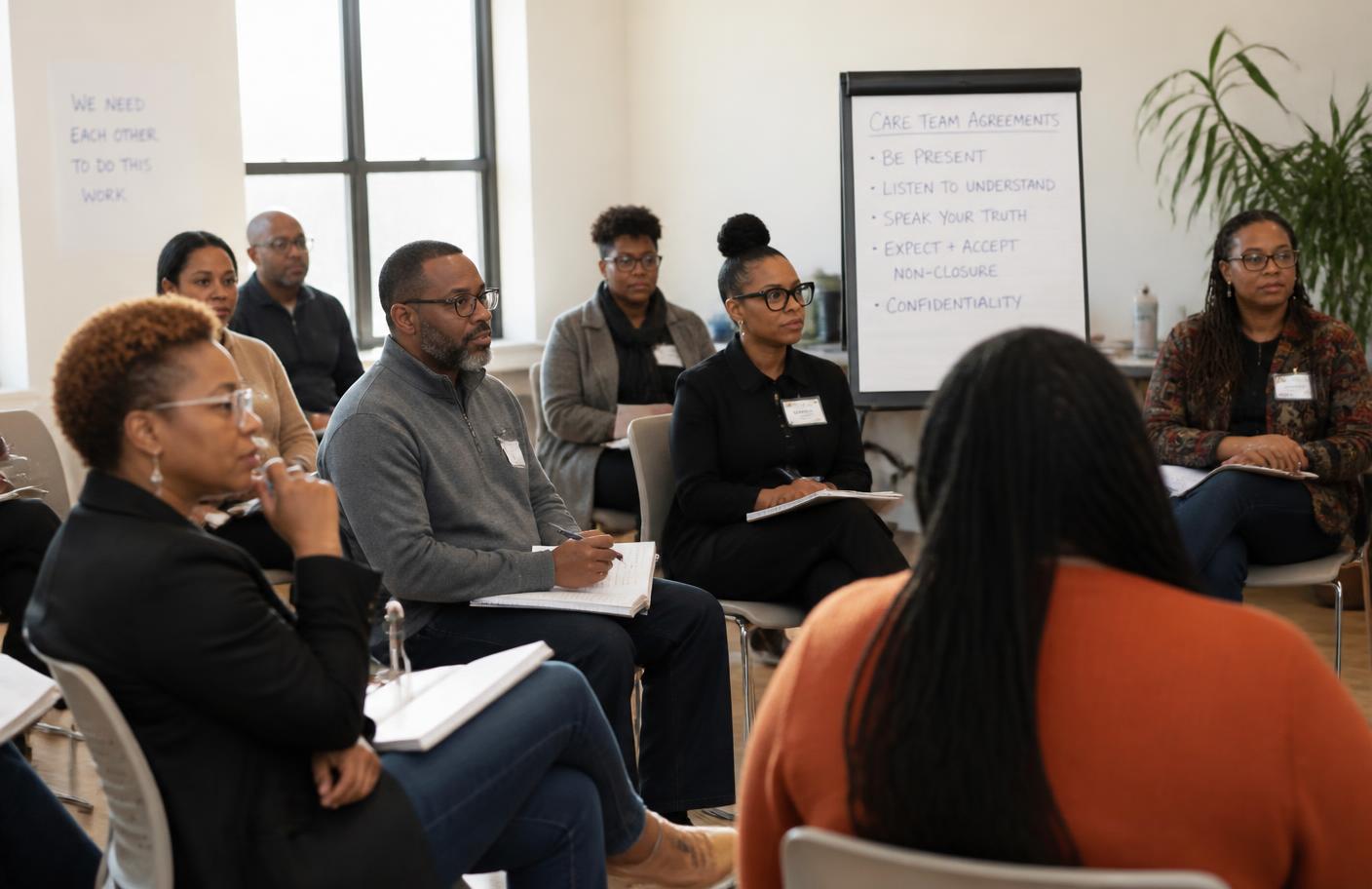 A cohort of care team leaders in a workshop circle